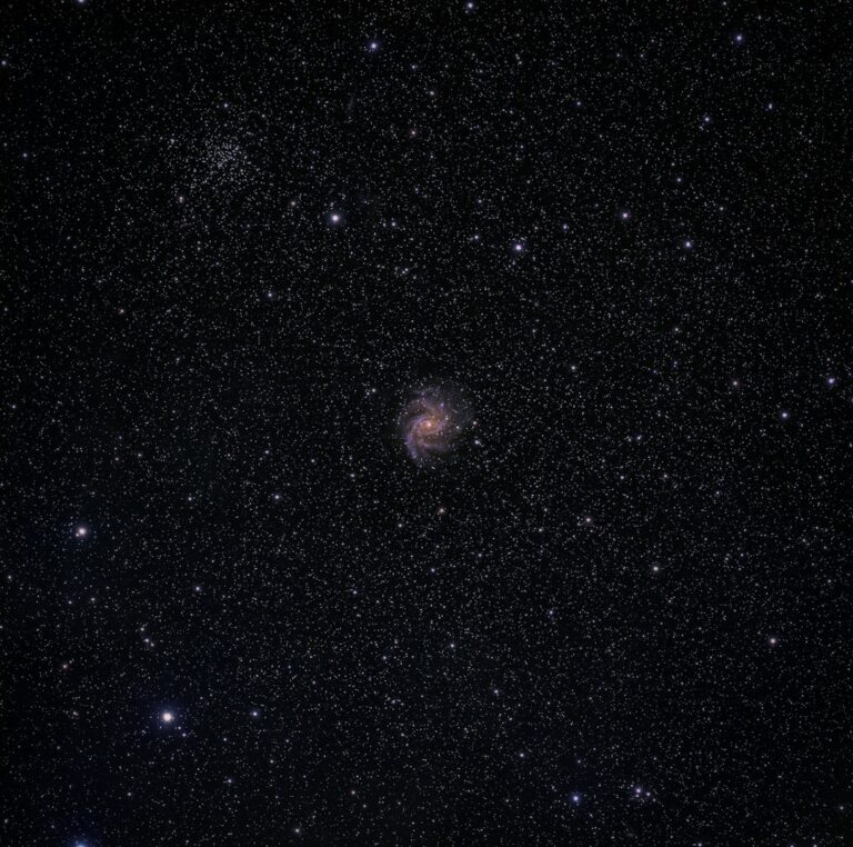 A spiral galaxy amidst a star-filled night.