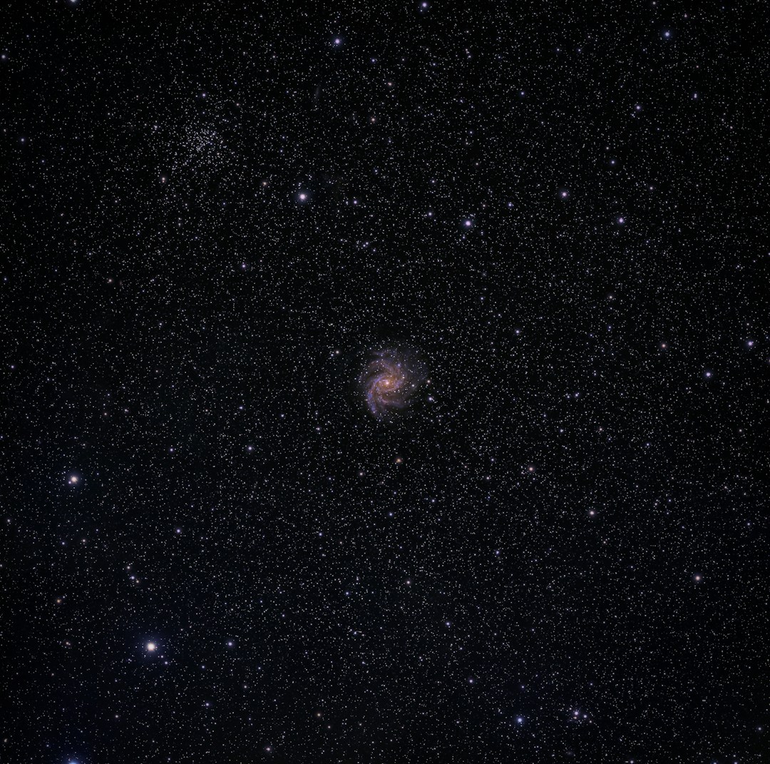 A spiral galaxy amidst a star-filled night.